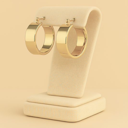 Geometric stainless steel hoop earrings on elegant display stand.
