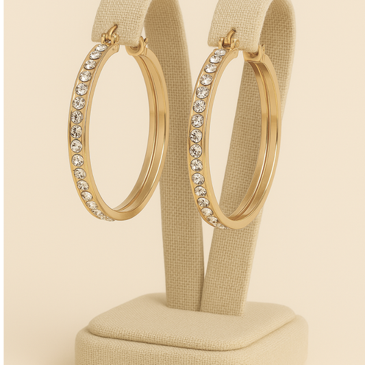 Elegant stainless steel rhinestone hoop earrings with round inlay design.