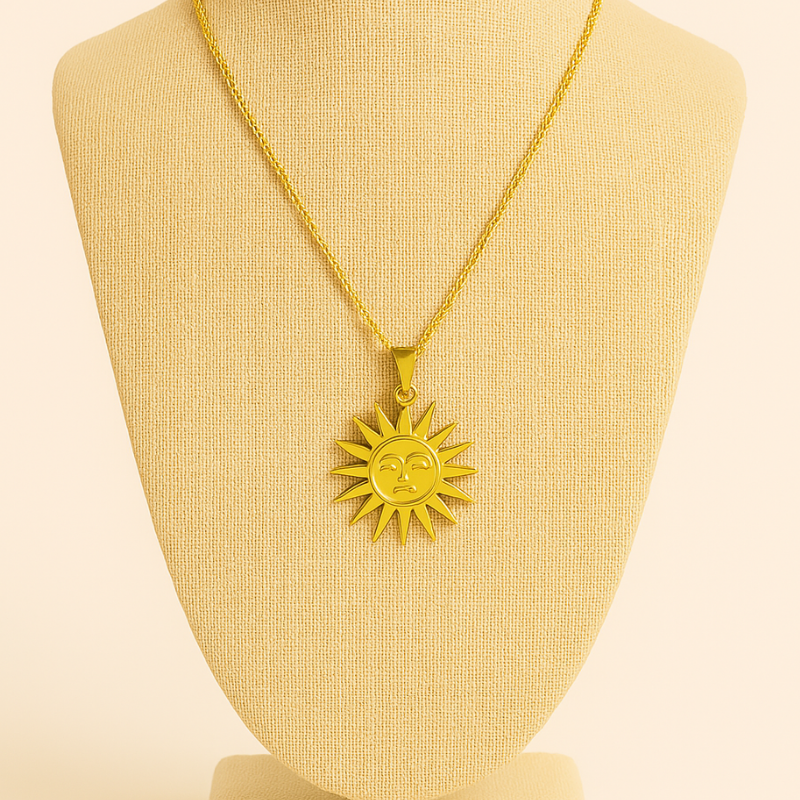 Simple style sun 18K gold plated necklace on a display stand.