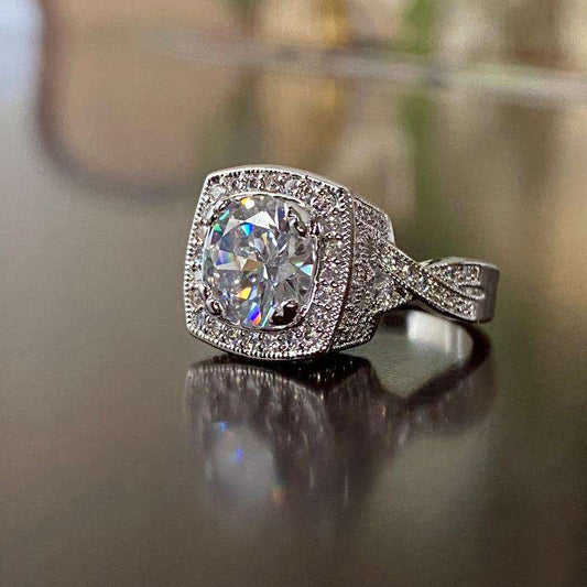 Clear Classic Ring with round-cut center stone and halo design in sterling silver.