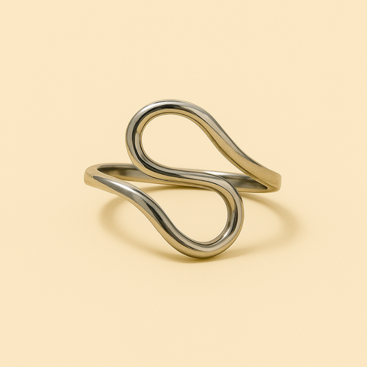 Elegant silver infinity twist ring with luminous stainless steel finish.