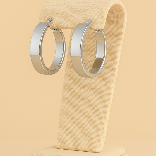 Geometric stainless steel hoop earrings with retro design on display.