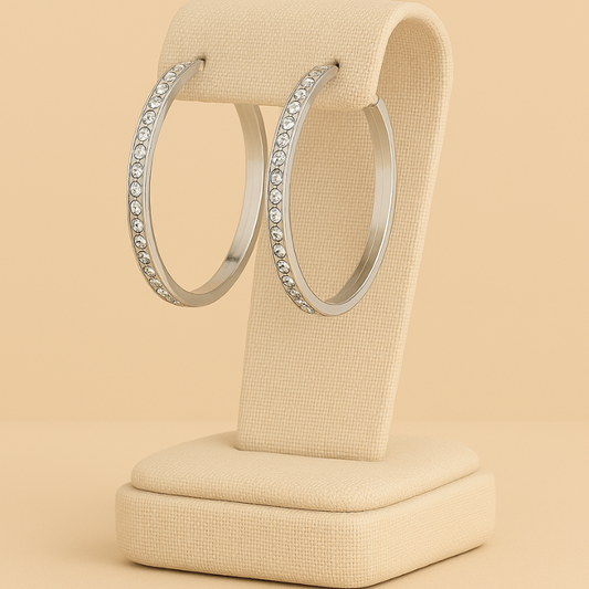 Elegant stainless steel rhinestone hoop earrings on stand, modern handcrafted design by NueJewelz.