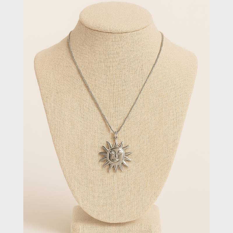 14K Gold Sun Pendant Necklace on display; dainty minimalist jewelry by Nue Jewelz featuring a sun design on an 18-inch chain.
