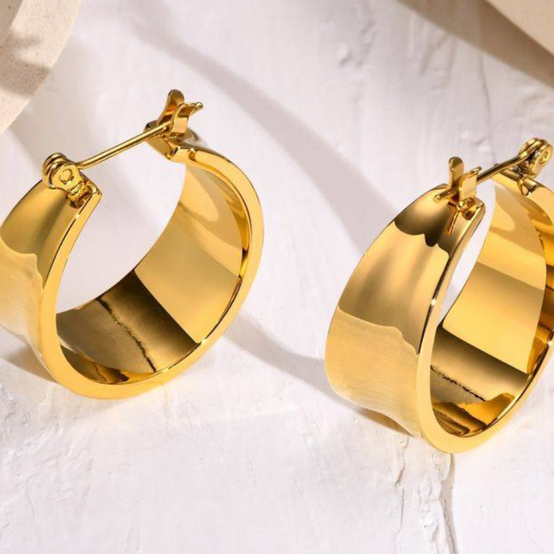 Gold hoop earrings on a white background