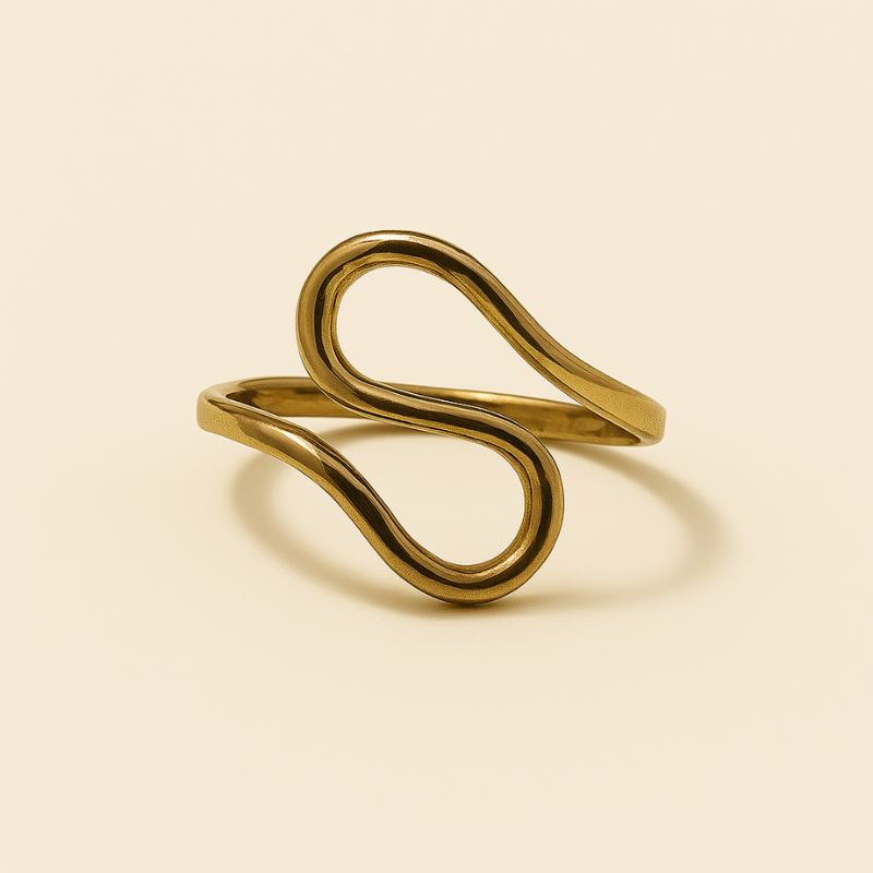 Luxurious gold infinity twist ring with elegant design, embodying timeless elegance and empowerment.