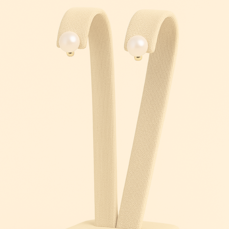 304 stainless steel pearl stud earrings with 14K gold plated accents, showcasing timeless elegance and sophistication.
