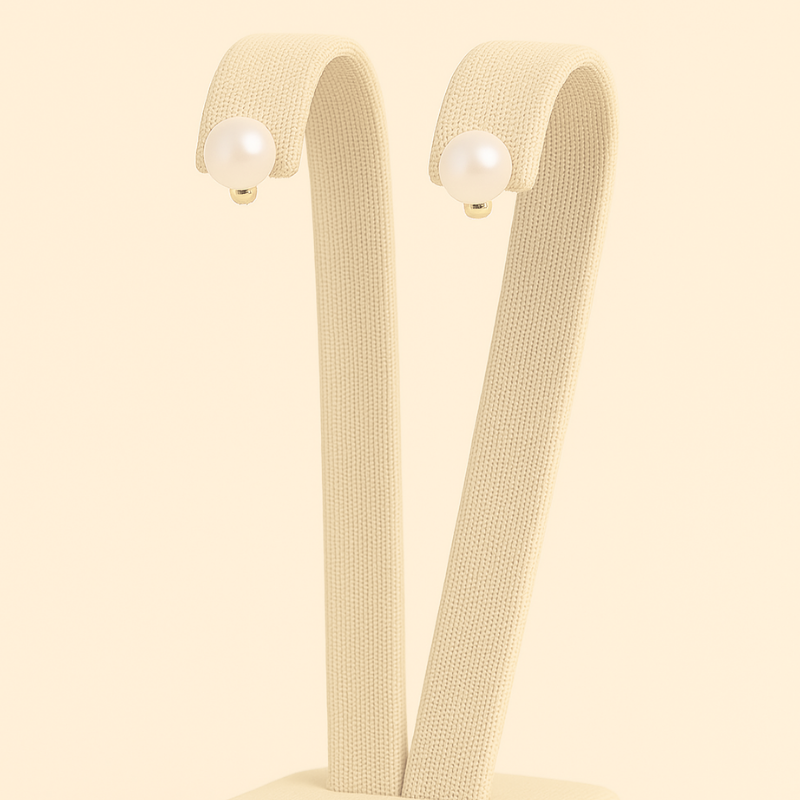 Pearl stud earrings in gold featuring luxurious white pearls by NueJewelz.