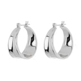 Stainless steel geometric hoop earrings with polished finish.