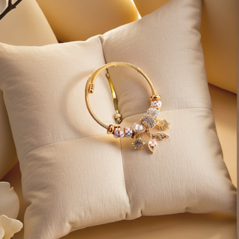 Classic Four-Leaf Clover & Fish Tail Gold-Plated Rhinestone Bracelet by NueJewelz on display.