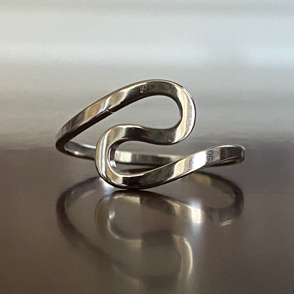 Elegant silver infinity twist ring with a sleek stainless steel finish.