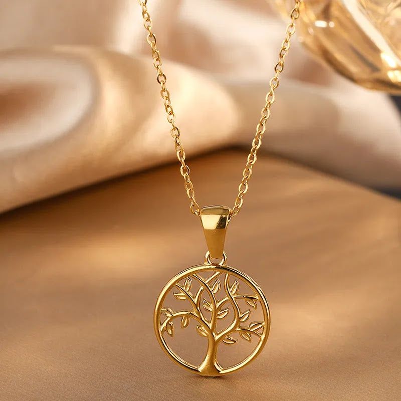 Elegant Round Tree Of Life Necklace with 18K gold plating and intricate tree design on a stainless steel pendant.