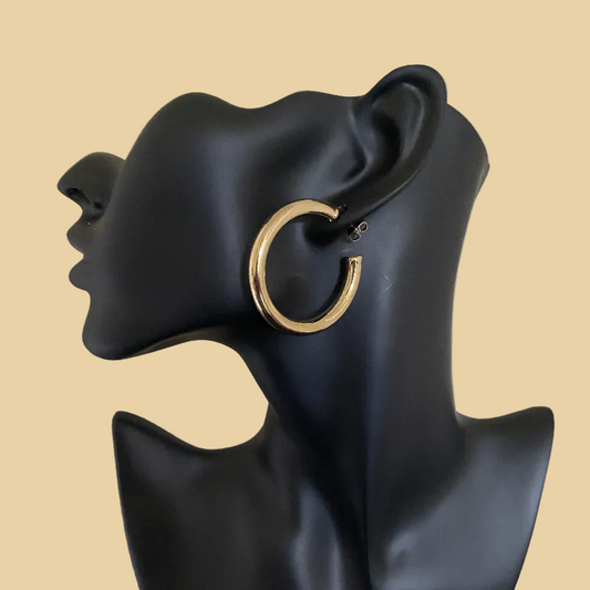 The Everyday Hoop stainless steel open design gold hoop earring on black mannequin head