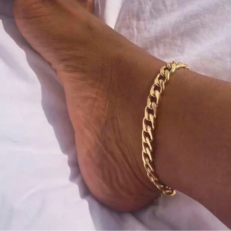 The Glow Link Chain gold-plated stainless steel anklet on skin with a smooth, adjustable fit and tarnish-resistant finish