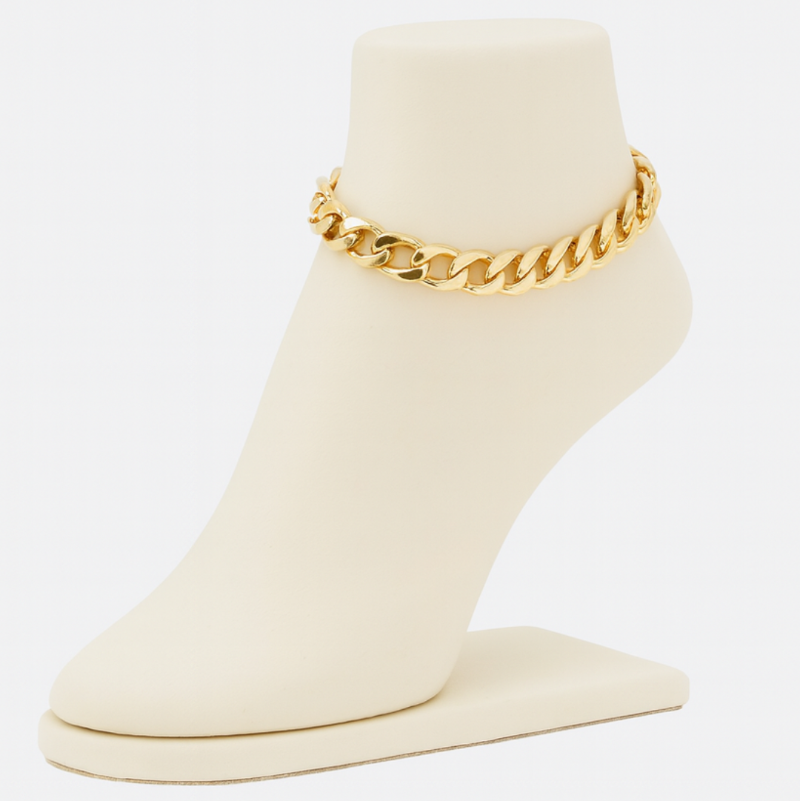 Gold chain anklet on a white stand with a white background