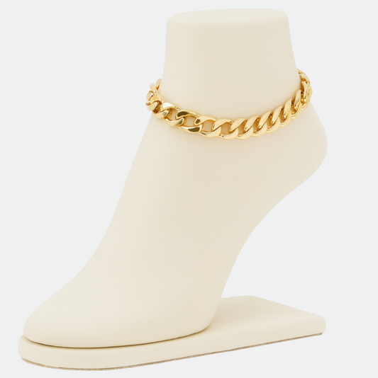 Gold chain anklet on a white stand with a white background