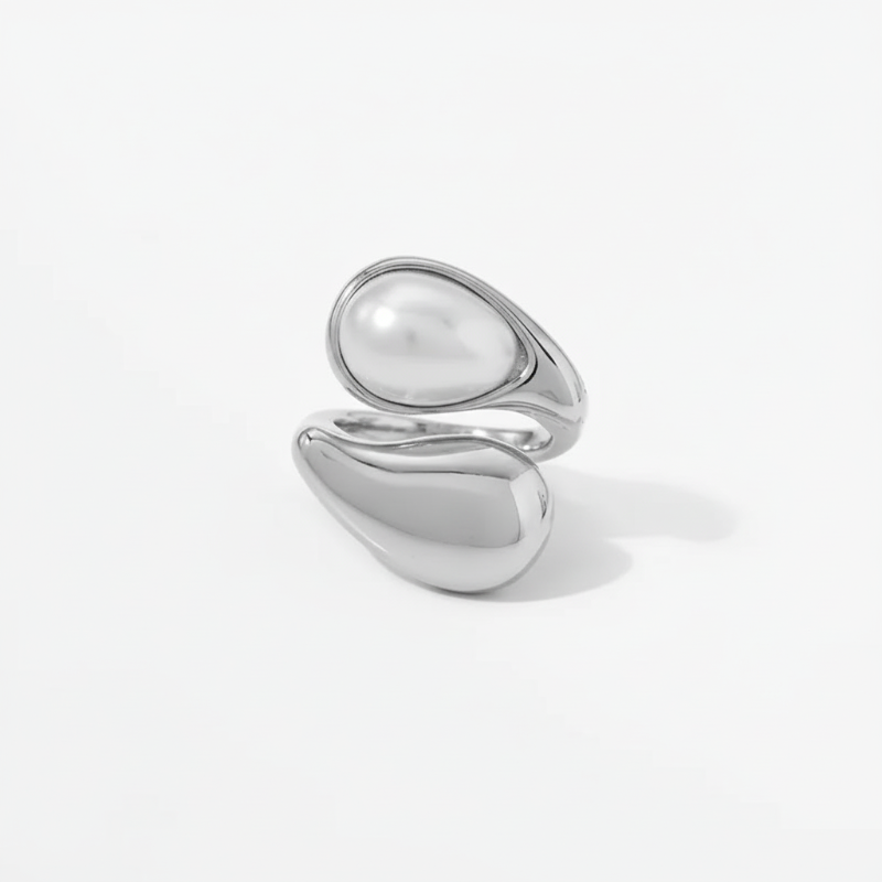 Adjustable stainless steel ring with baroque pearl and sculptural dual-band design
