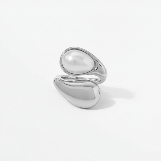 Adjustable stainless steel ring with baroque pearl and sculptural dual-band design