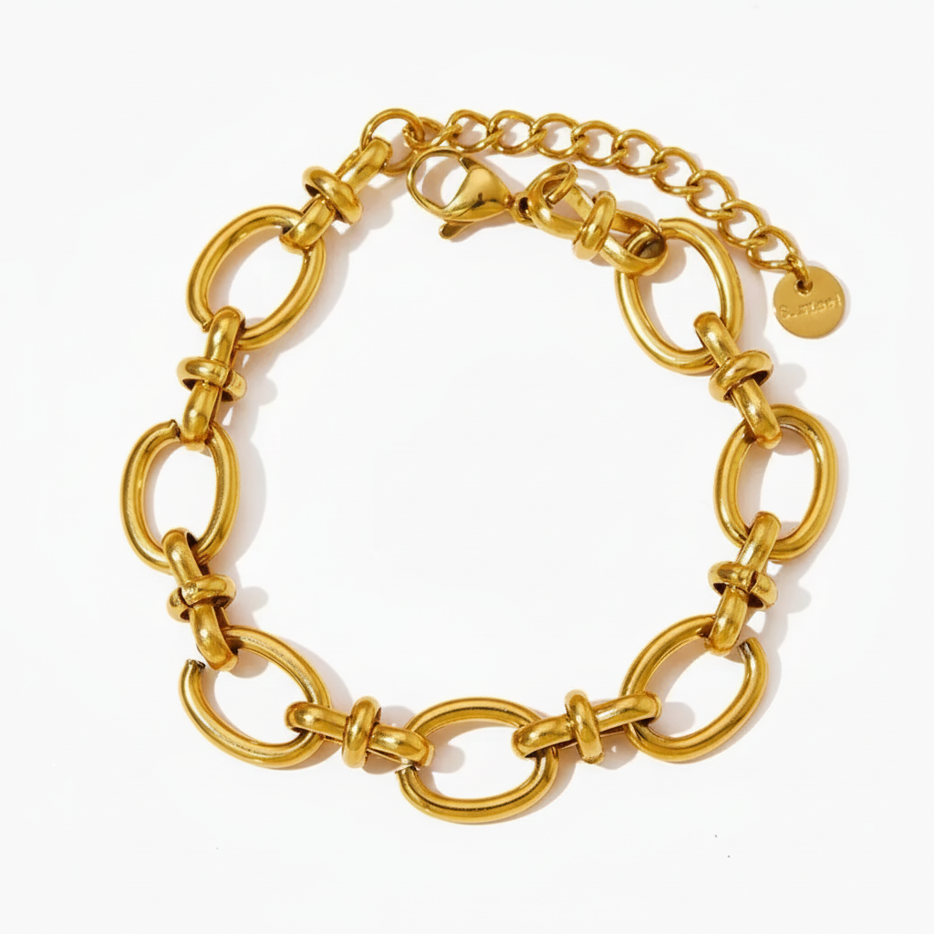 The Golden Knot Link Bracelet with bold oval gold links and decorative knot details, adjustable chain closure.