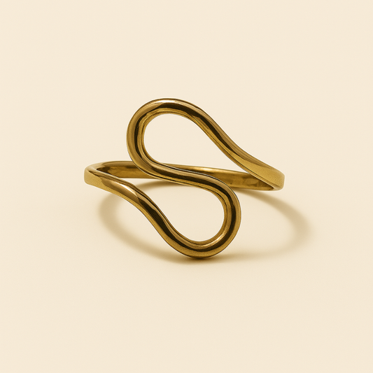 Luxurious gold infinity twist ring with elegant design, embodying timeless elegance and empowerment.