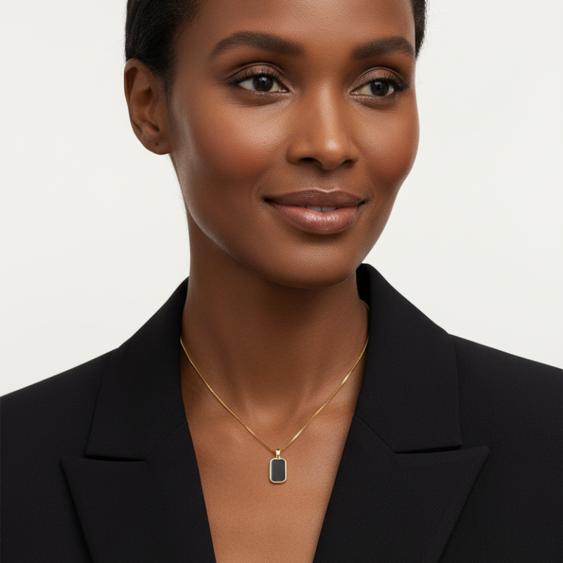 The Anchor Pendant gold-tone frame black inlay titanium necklace worn on woman