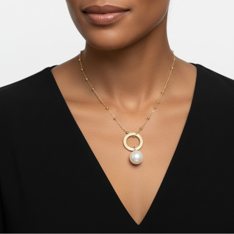 Elegant 304 stainless steel pearl necklace with textured gold-tone ring and delicate bead accents worn on model