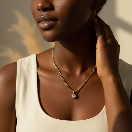 Gold oval stainless steel pendant necklace with crystal on curb chain