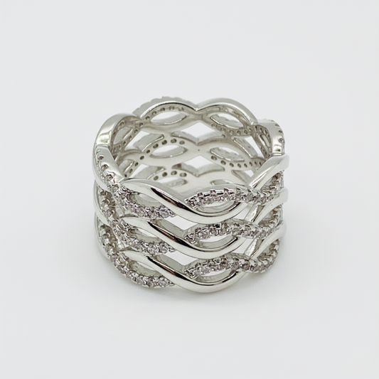 Silver cocktail ring with multi-band woven wave design and cubic zirconia stones