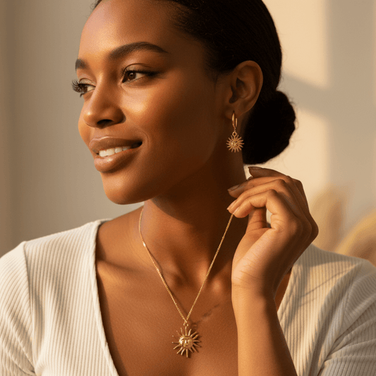 Gold sun pendant necklace and earring set with detailed face and rays, hypoallergenic stainless steel jewelry