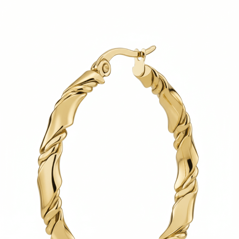 Gold hoop earring on a white background